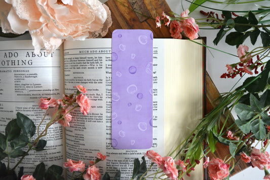 Bookmark with illustrations of bubbles in different shades of purple.