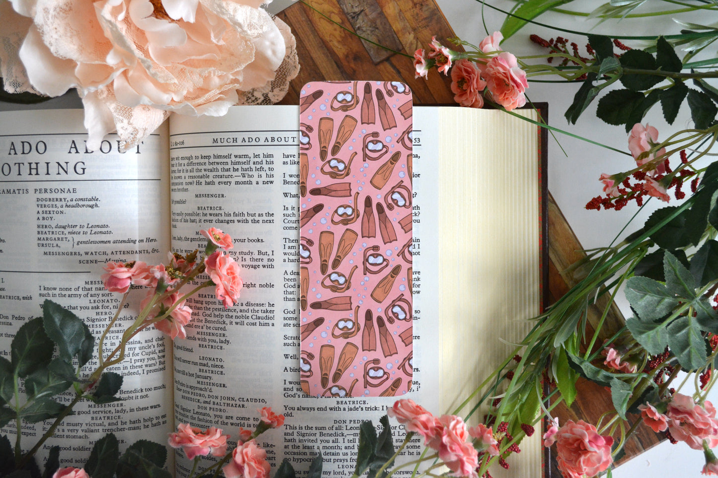 Pink bookmark with illustrations of snorkel gear.
