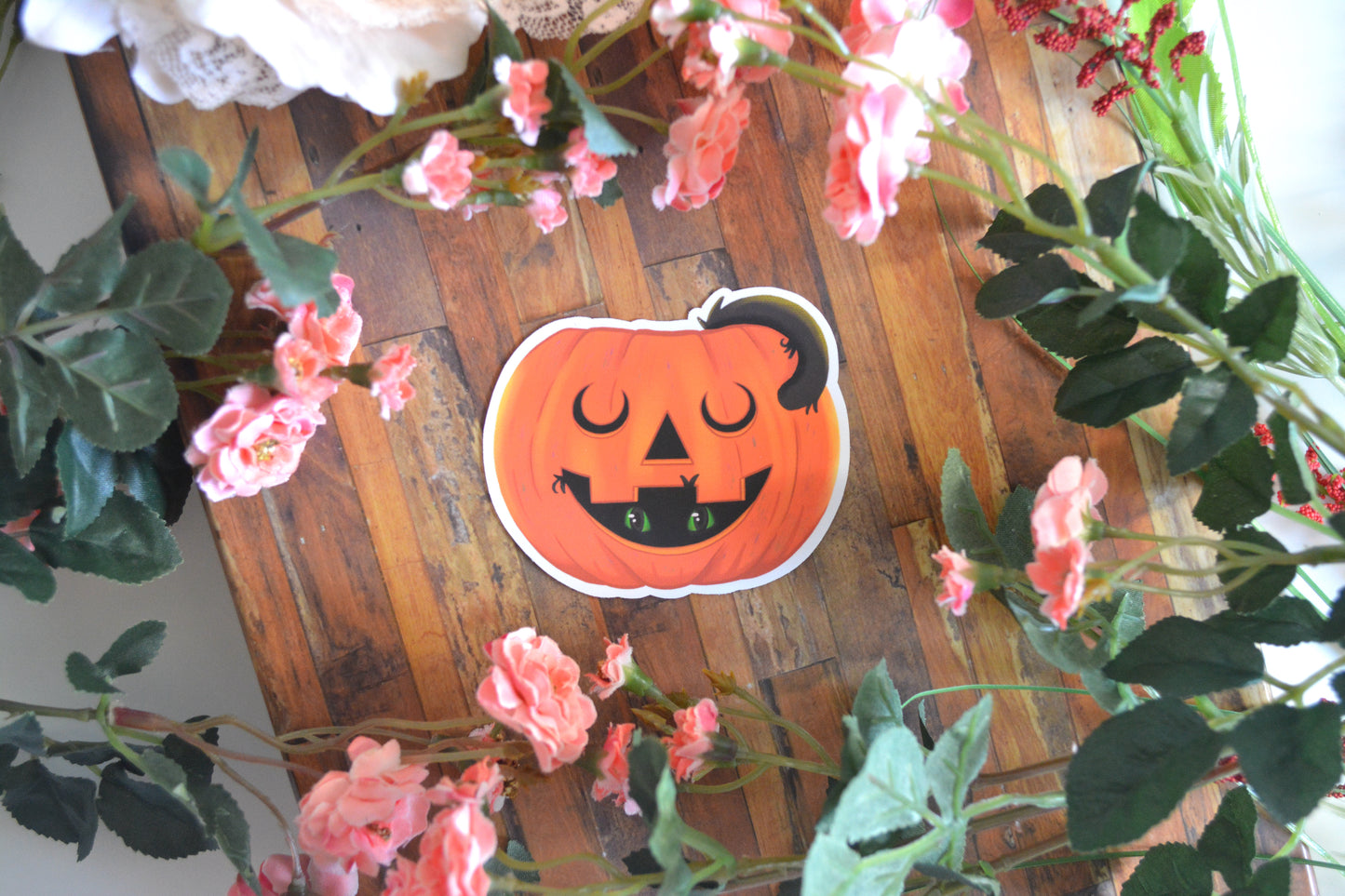 Halloween sticker of a black cat in a jack-o-lantern