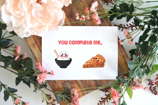 Greeting card with "You Complete Me" text and ice cream and pie images on front.