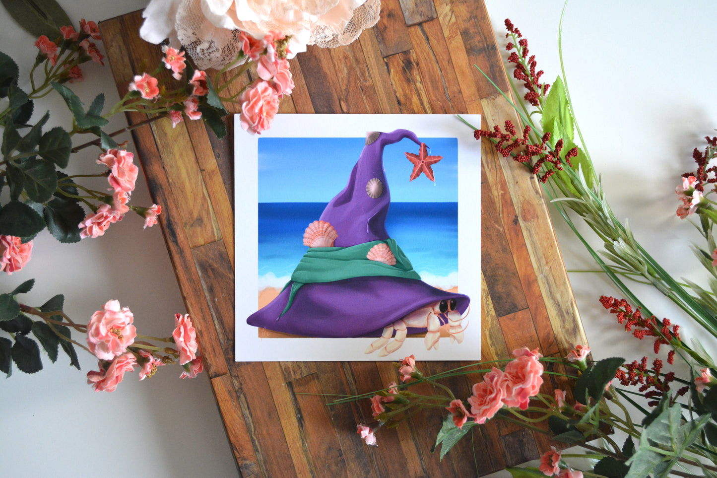 Art print illustration of a hermit crab wearing a purple witch's hat as its unique new home.