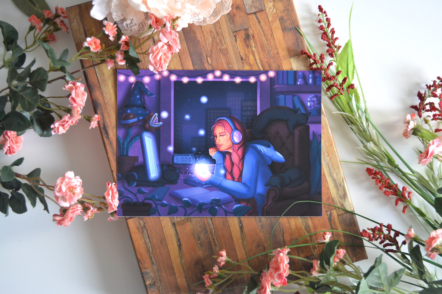 Art print illustration of a young female witch surrounded by her black cats in her cozy magical room at witching hour.