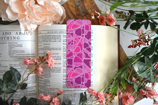 Bookmark with illustrations of mosaic tiles of hibiscus in varying shades of pink.