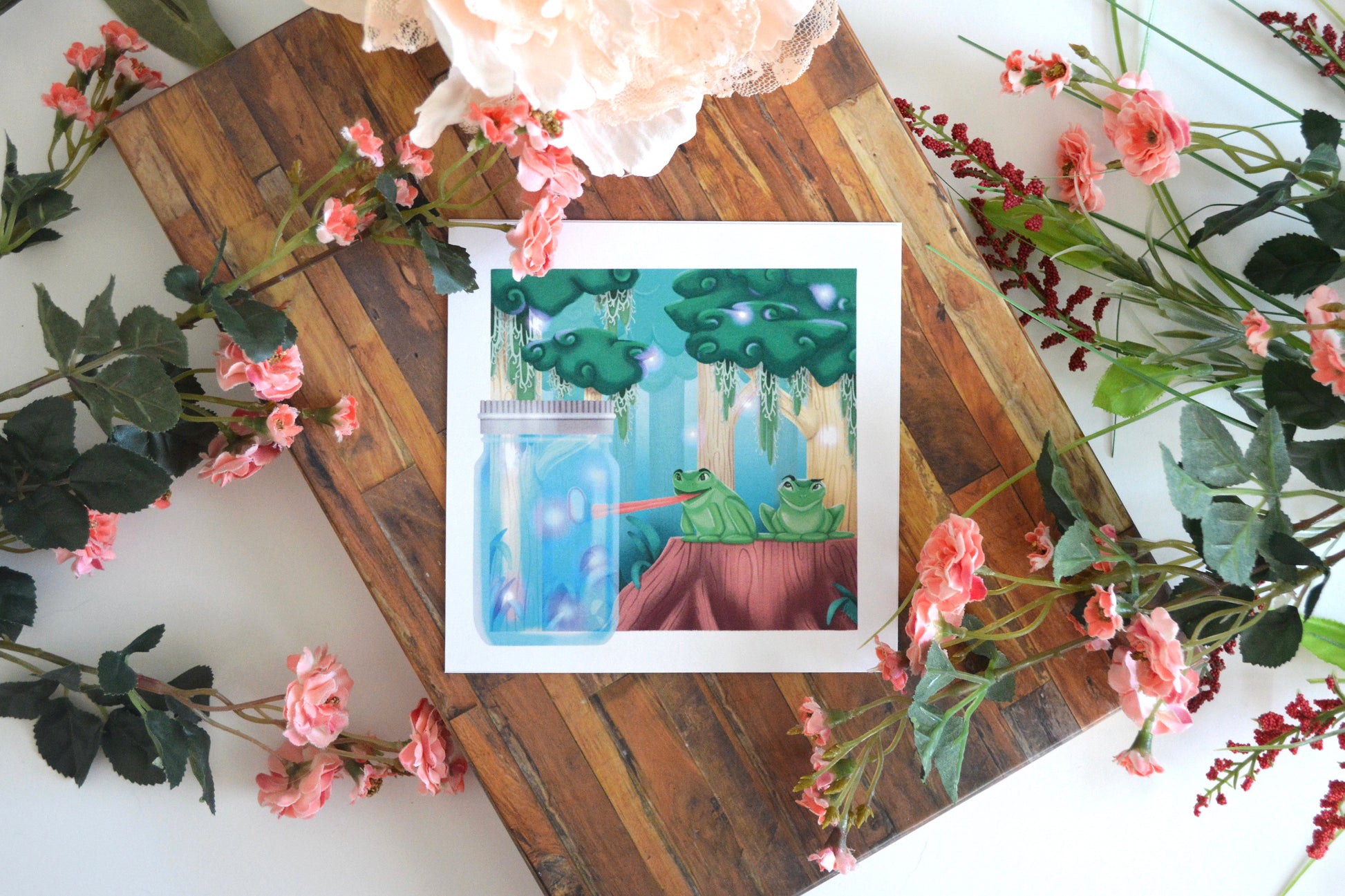 Art print of an illustration of two tree frogs sitting on a tree stump in a forest, trying to eat fireflies in a jar.